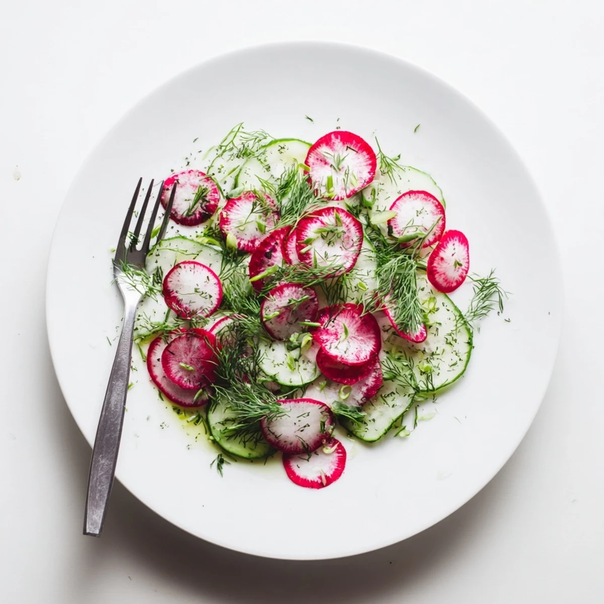 Fresh radish and cucumber salad tossed with green onions and dill in light dressing