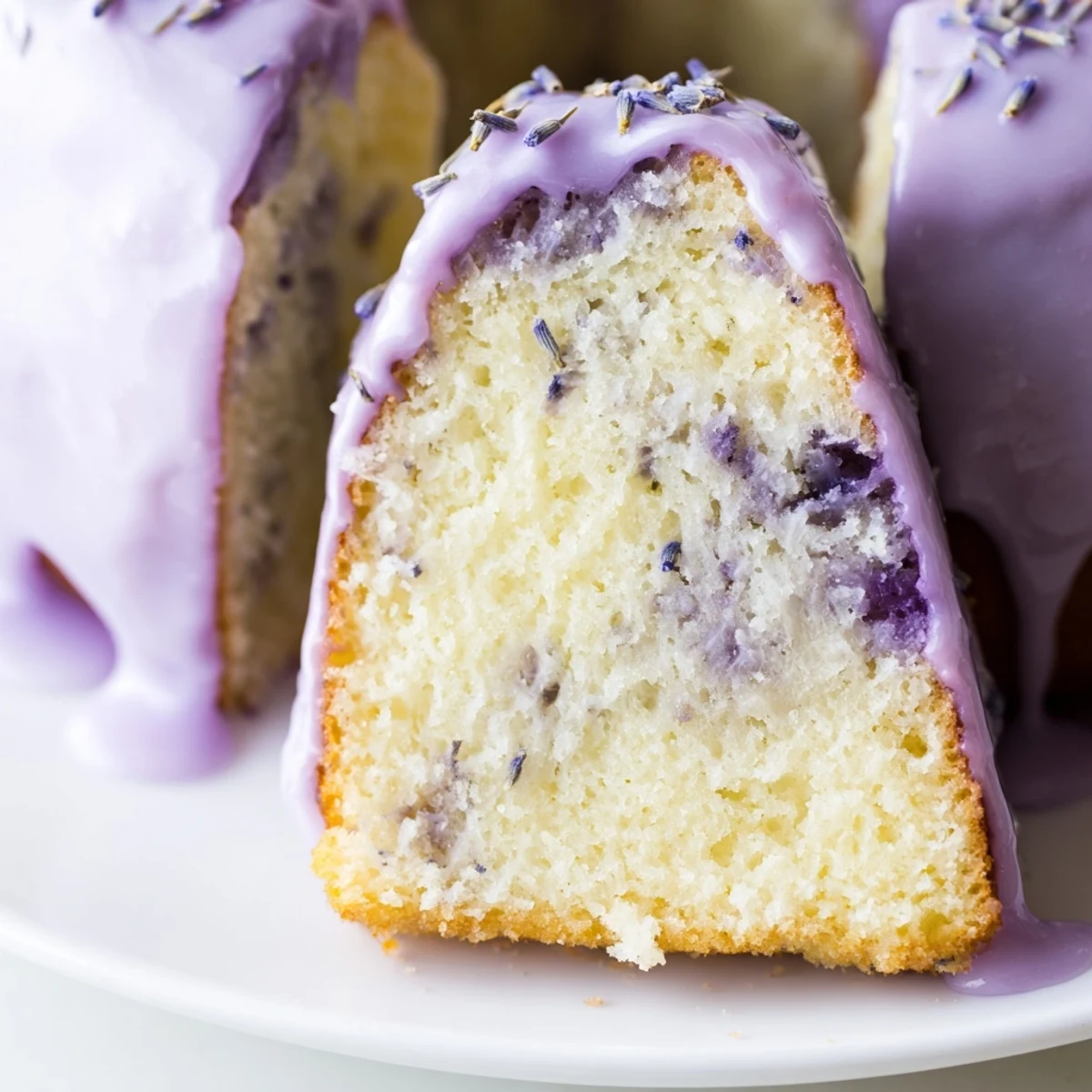 A slice of fragrant lavender cake on a decorative plate for an elegant spring dessert