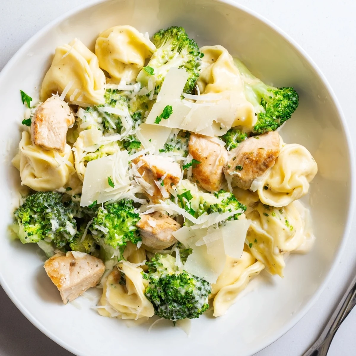 Comforting Creamy Garlic Parmesan Tortellini Chicken Broccoli Recipe in silky garlic and Parmesan cream