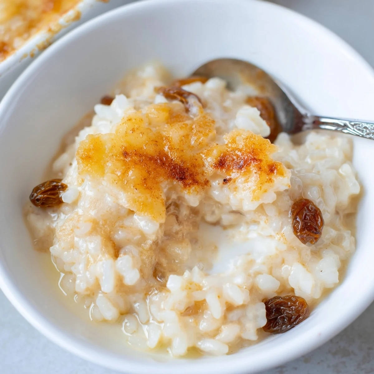 Warm Delicious Condensed Milk Baked Rice Pudding, golden top, creamy interior