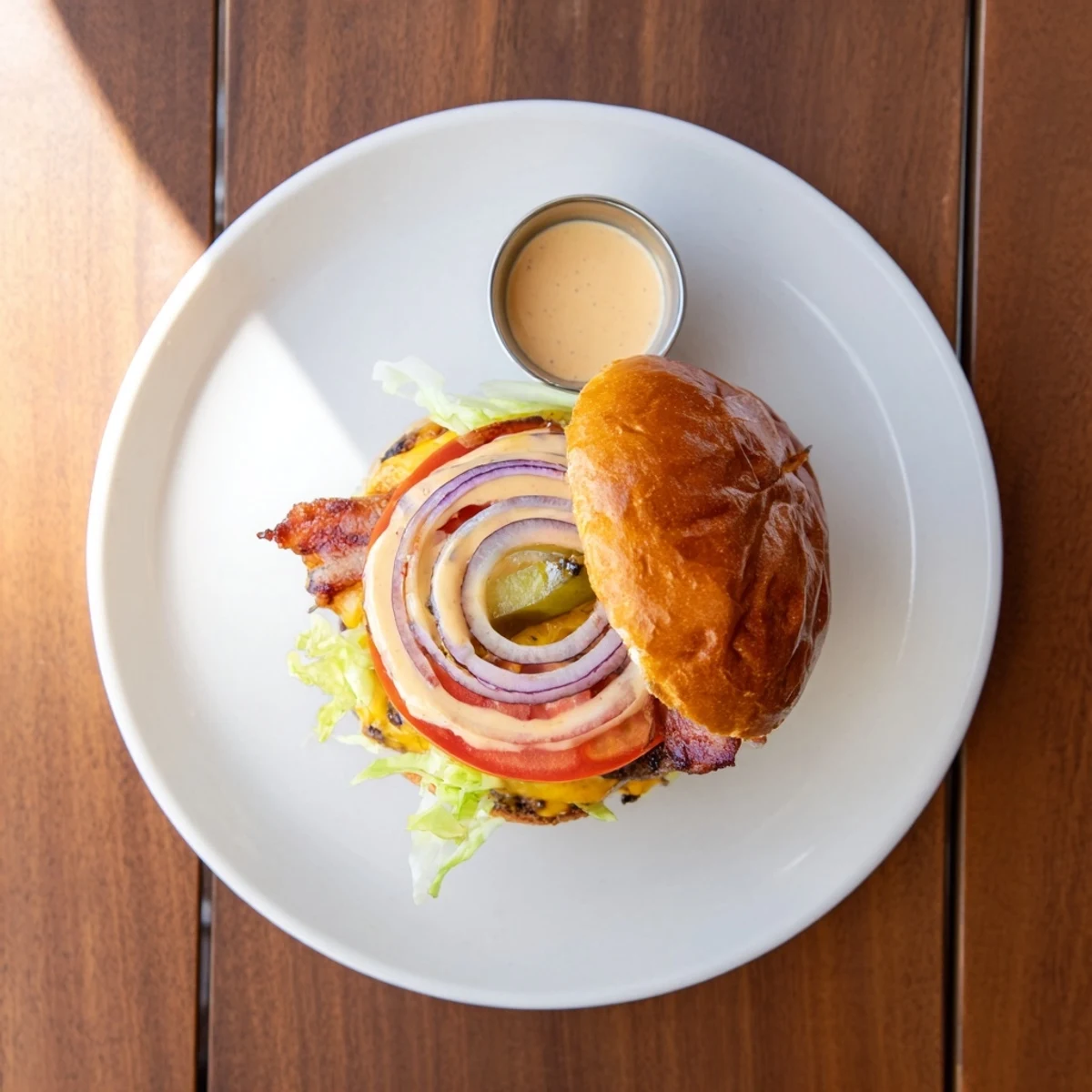 Irresistible Crack Burgers oozing melted cheddar, crispy bacon, toasted brioche bun.