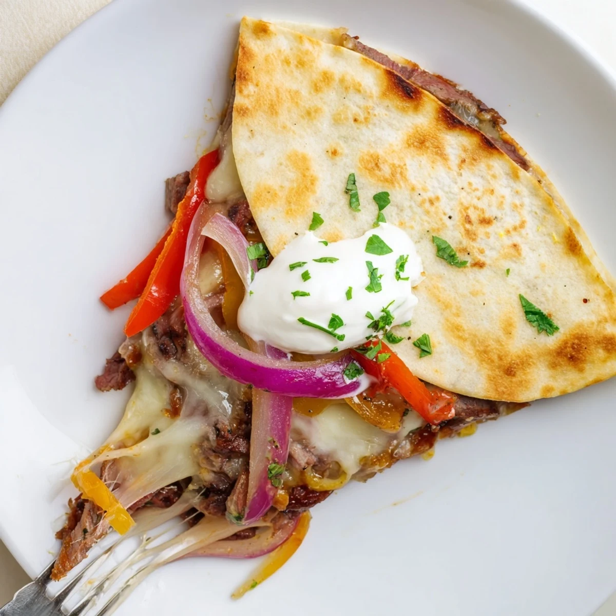 Sweet Savory Beef Quesadillas sizzling in skillet, golden tortillas and oozing cheese