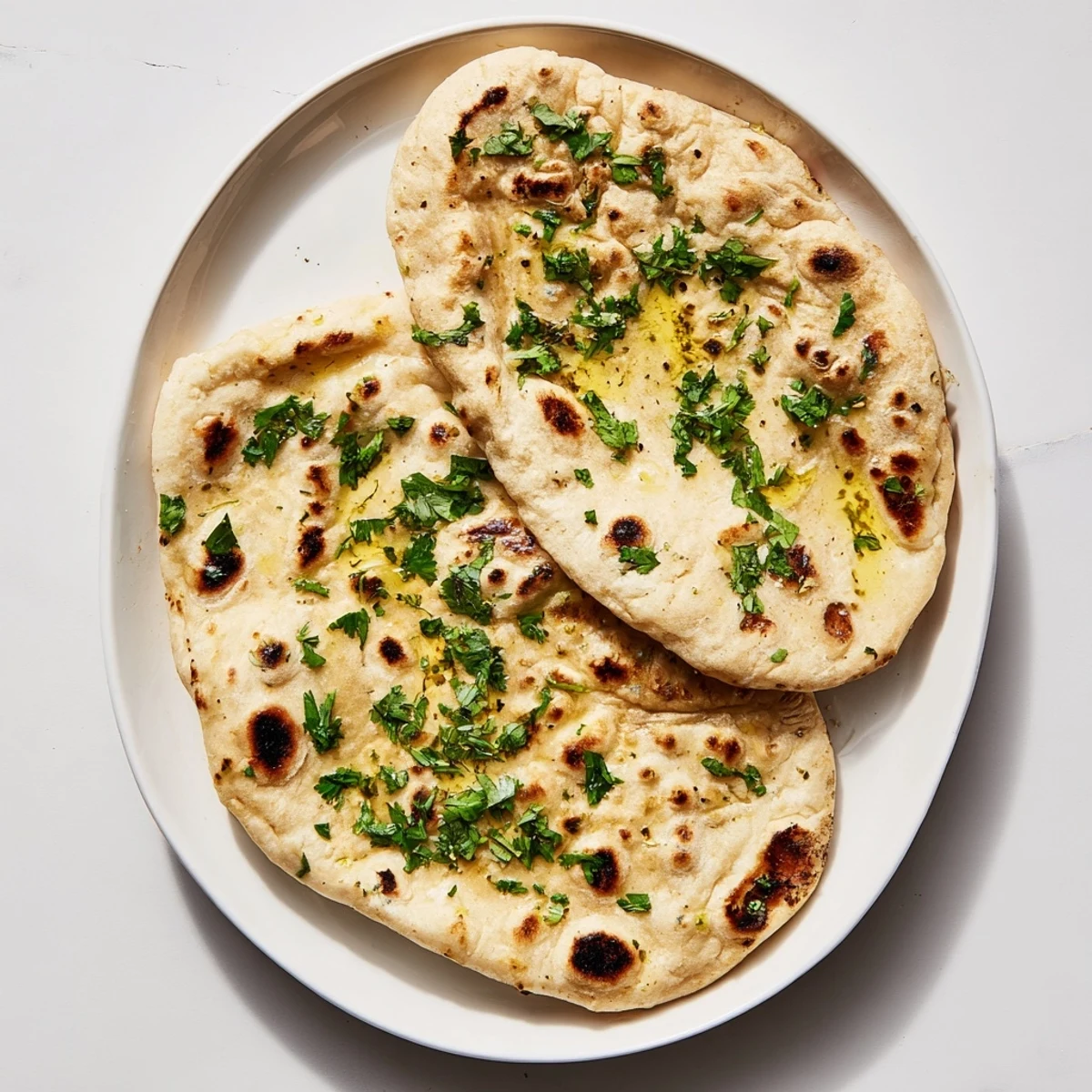 Pillowy soft Indian flatbread made with sourdough discard, perfect for scooping savory curries and dips